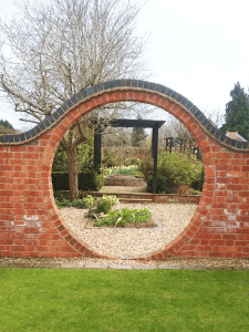 Image of Moon Gate and Pergola in background